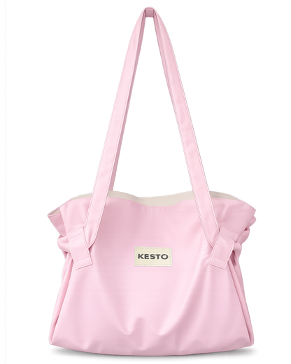 A light pink fabric tote bag with long shoulder straps, gathered ruffle details on the sides, and a small white rectangular patch on the front featuring the brand name 'KESTO'.