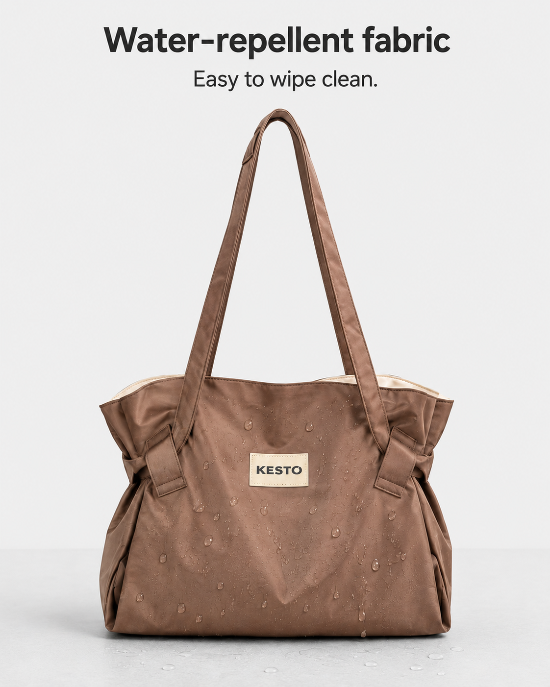 A brown water-repellent fabric tote bag with dual shoulder straps and a beige KESTO brand patch on the front, displayed against a light gray background with text reading 'Water-repellent fabric Easy to wipe clean.'.